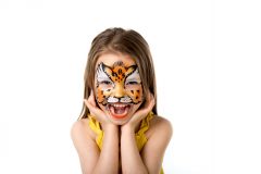 cute little girl with colorful painted face like tiger